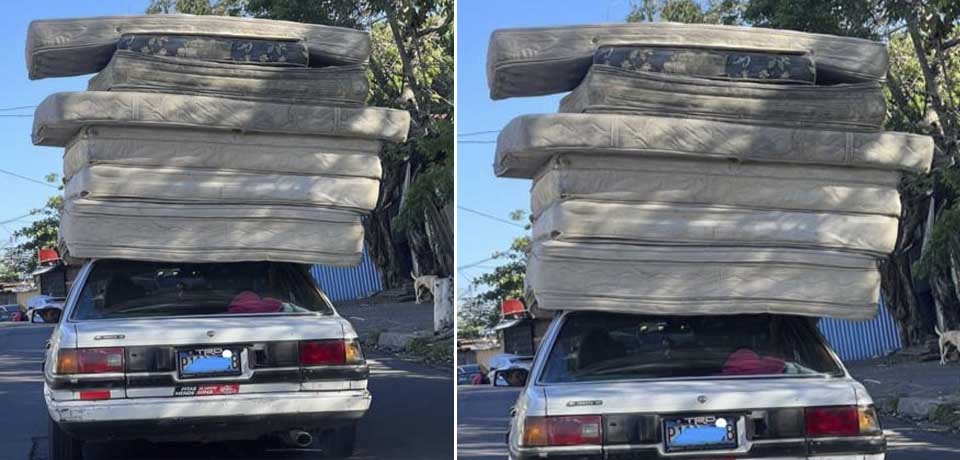 Salvadoreño se las ingenia para transportar 7 colchones sobre el techo de su carrito