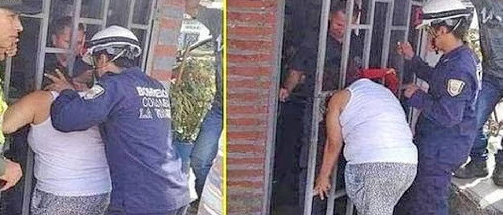 Mujer queda atrapada entre los barrotes de una puerta; quería saber qué hacía su vecina 
