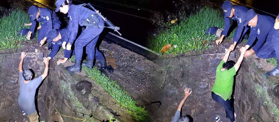 Agentes de la PNC rescatan a pareja de borrachos que salieron durante las fuertes lluvias