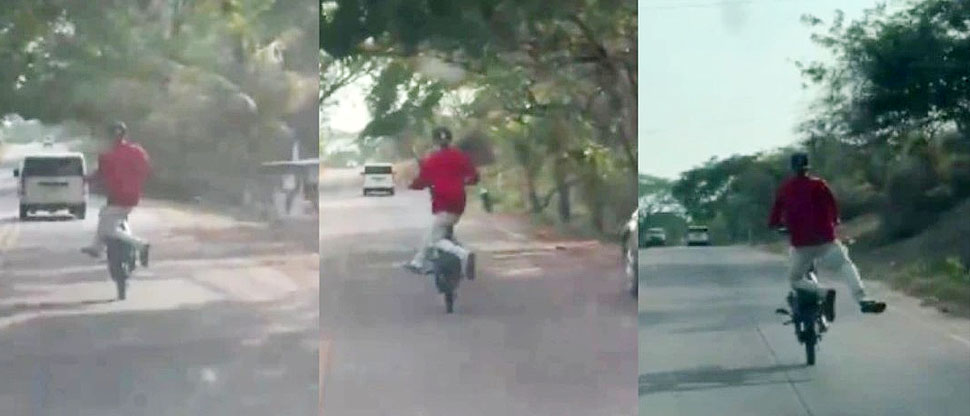 Motociclista casi ocasiona un accidente por hacer piruetas en plena carretera