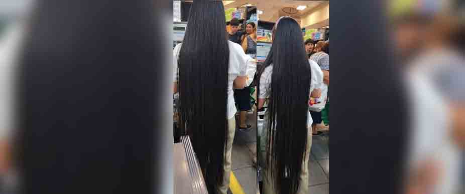 Viralizan a cajera de supermercado por tener el cabello más largo de El Salvador