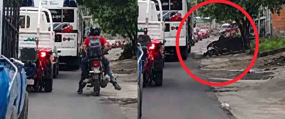 Biker se cae por ir sobrepasando a la derecha en Santa Ana